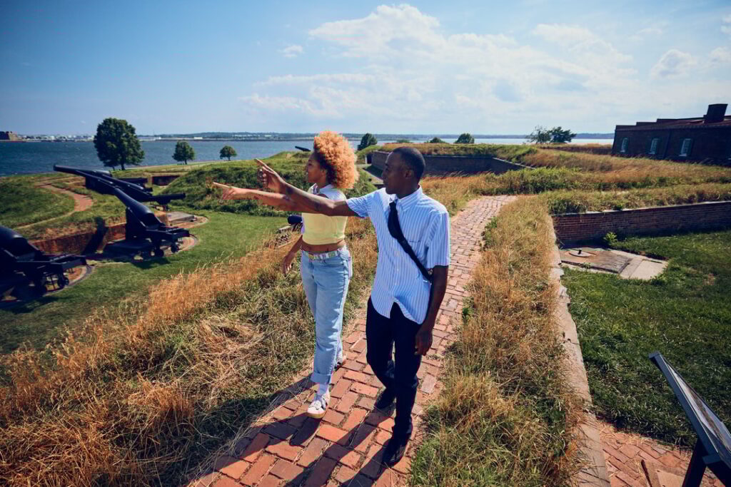 A young Black man and woman explore Fort McHenry