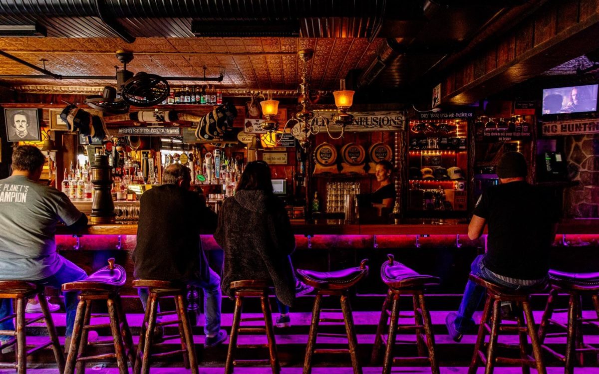 Customers at the bar of The Horse You Came In On Saloon in Baltimore.