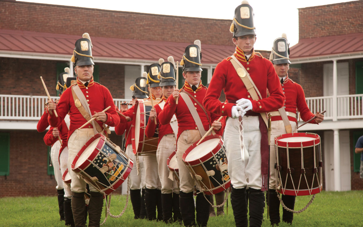 Farbs march behind the ramparts of Fort McHenry.