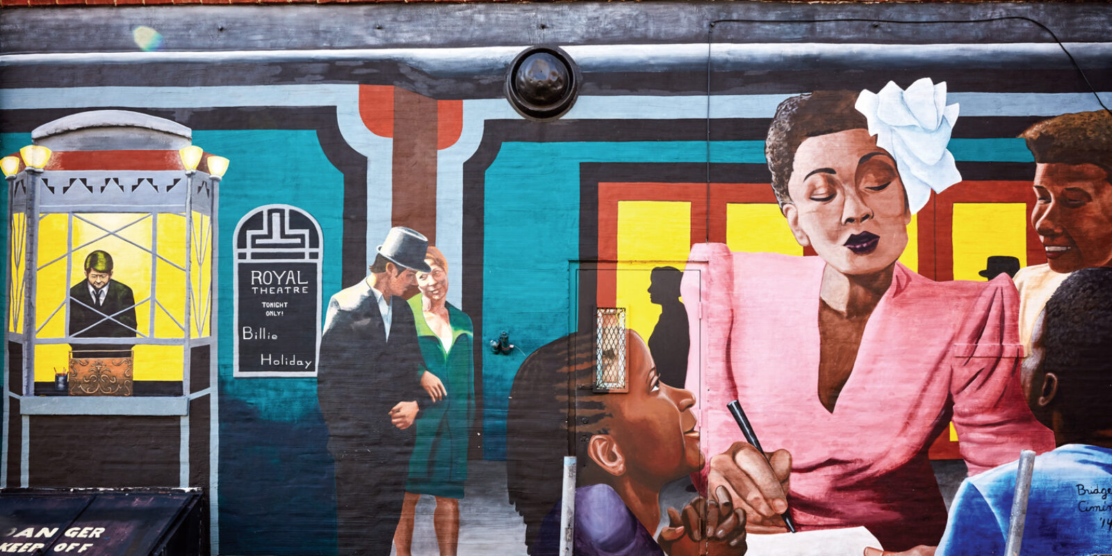 A mural of Billie Holiday is shown on the Royal Theater wall