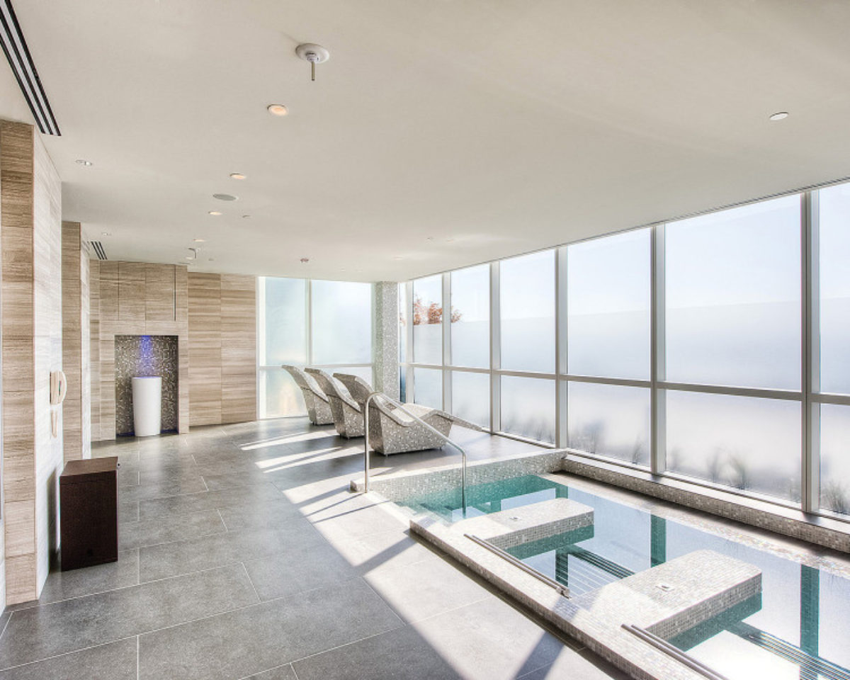 Interior of a spa with pools and reclining chairs.