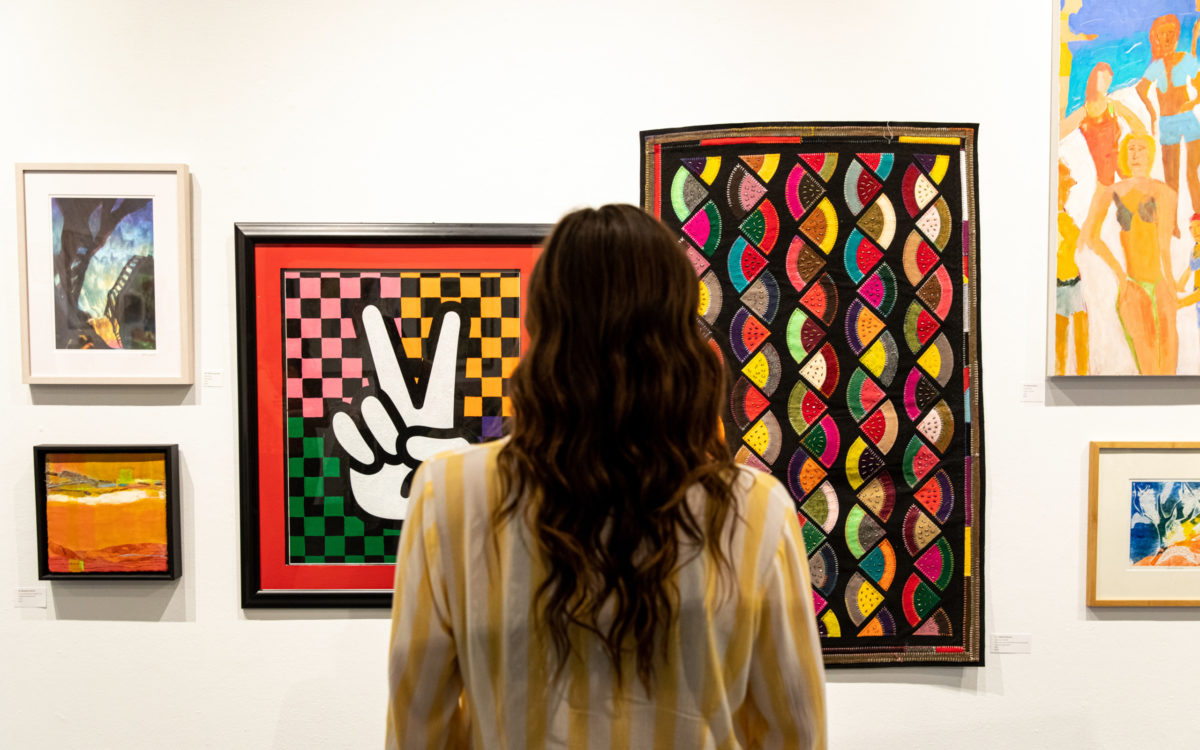 Woman viewing art at Creative Alliance