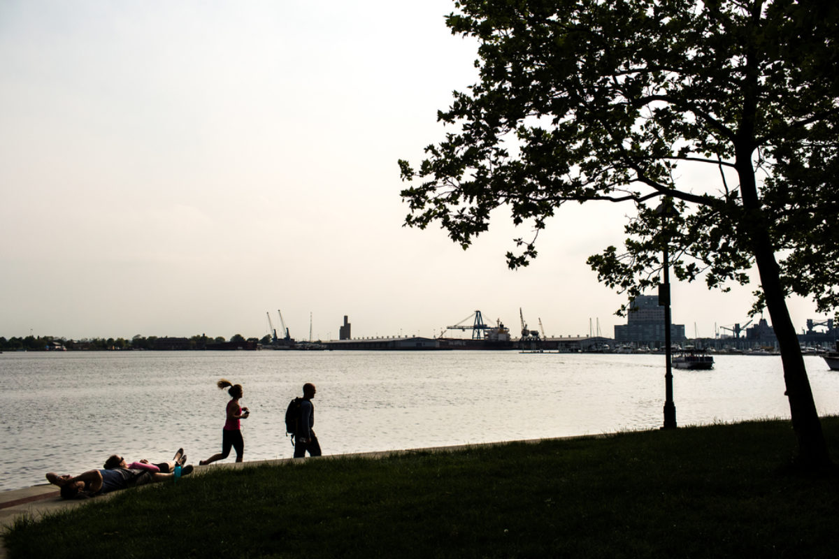 People running along waterfront