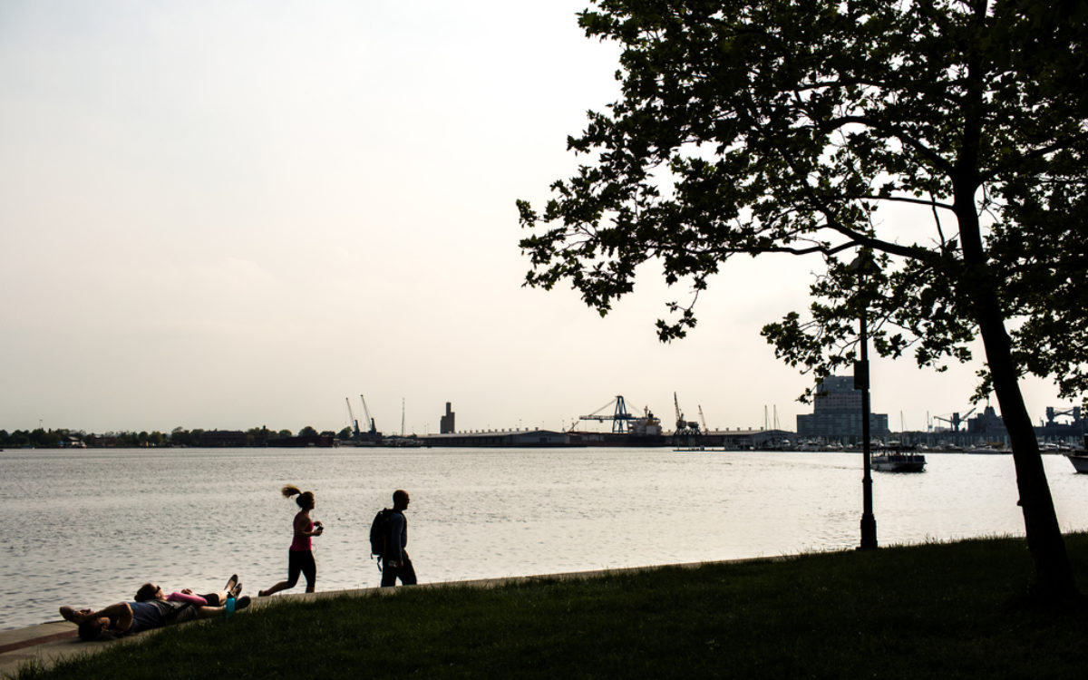 People running along waterfront