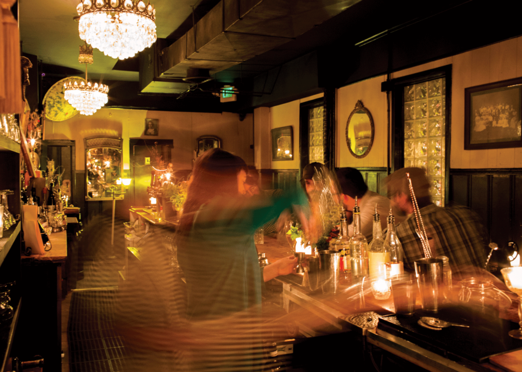 Justin Tsucalas Bartender pouring a cocktail at WC Harlan